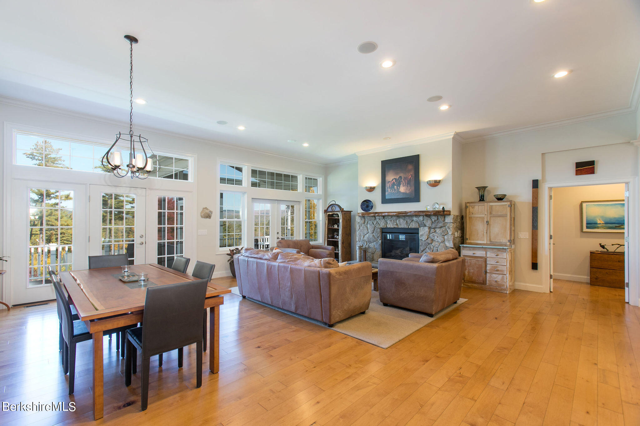 19 Burning Tree Road Great Barrington, MA 01230 - Photo 7 of 33 a living room with furniture wooden floor and a fireplace