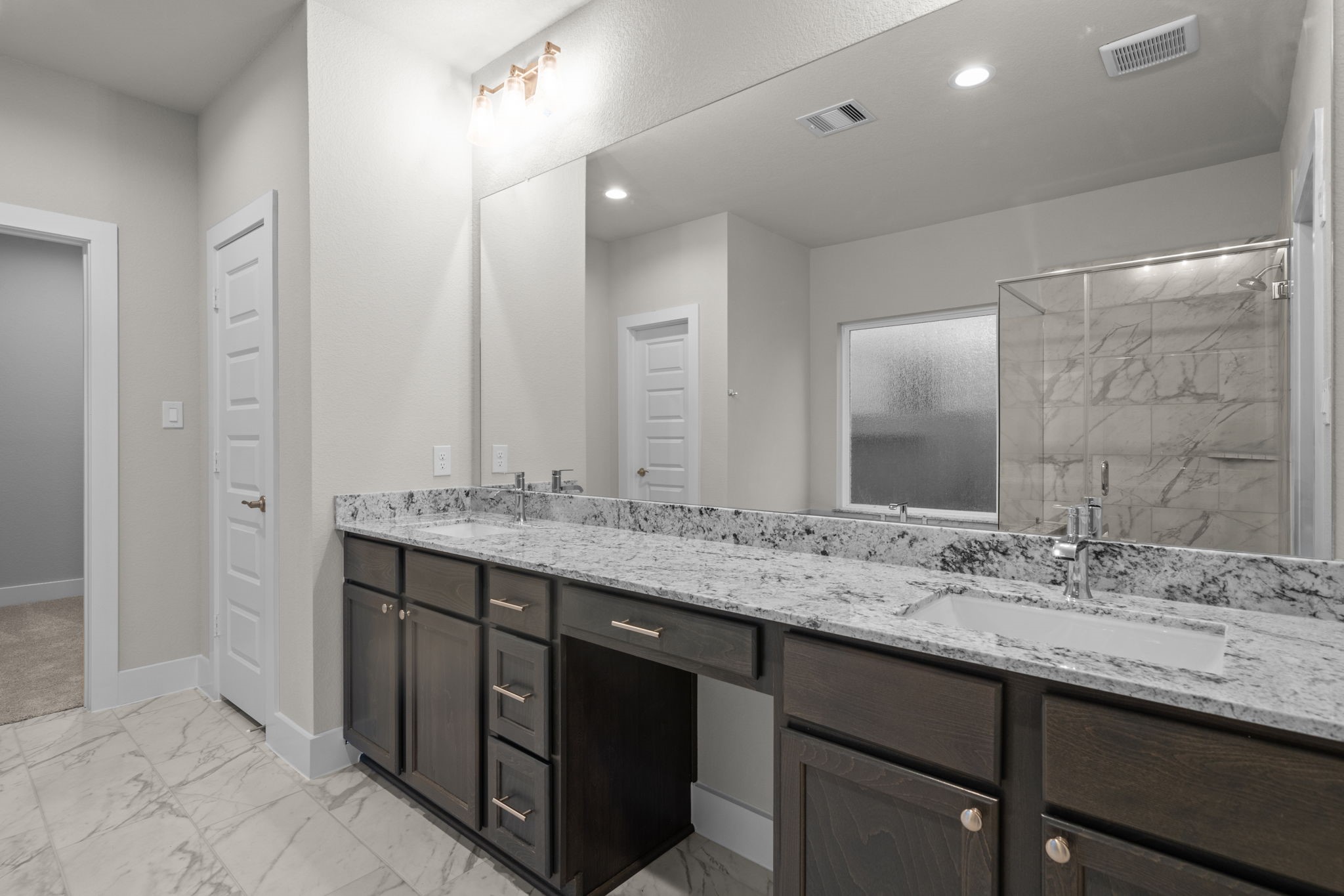 3414 Everglade Lane Rosenberg, TX 77471 - Photo 14 of 29 a bathroom with a granite countertop sink double and mirror