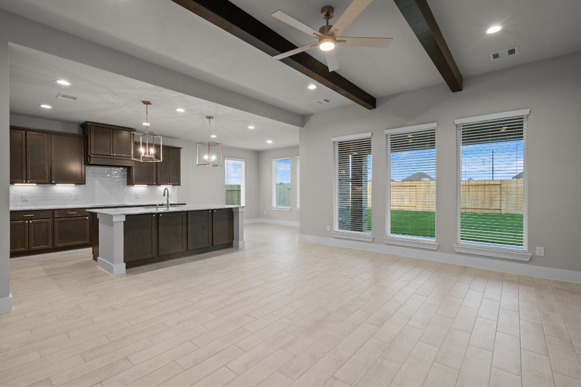 3414 Everglade Lane Rosenberg, TX 77471 - Photo 4 of 29 a large hall with kitchen island granite countertop a large window