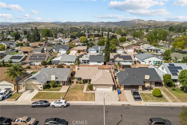 an aerial view of residential houses with outdoor space