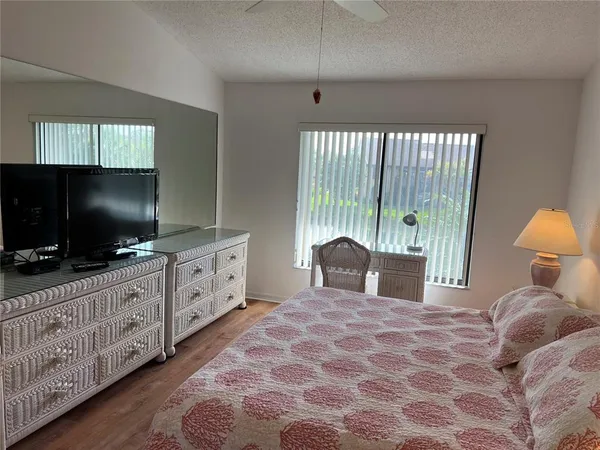 a bedroom with furniture and window