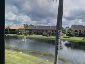 a view of residential house with lake view