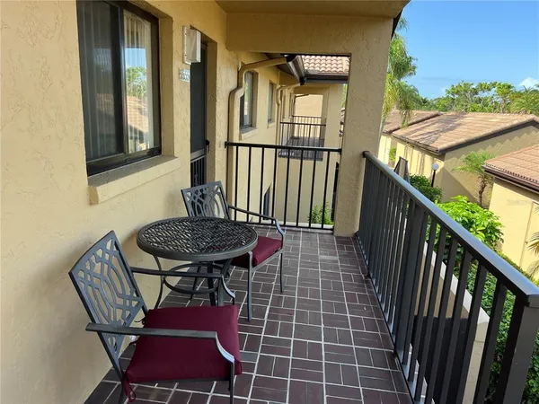 a view of a balcony with furniture