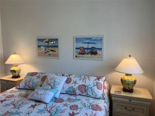 a living room with furniture and a lamp