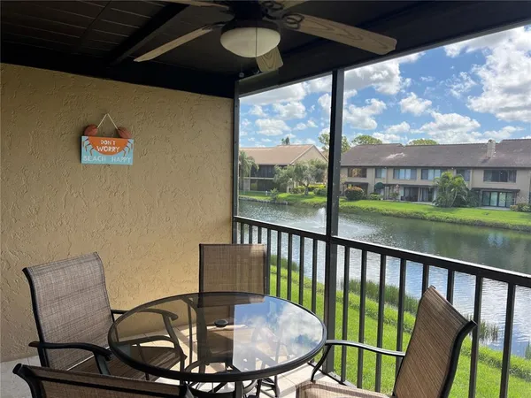 a view of a balcony with furniture
