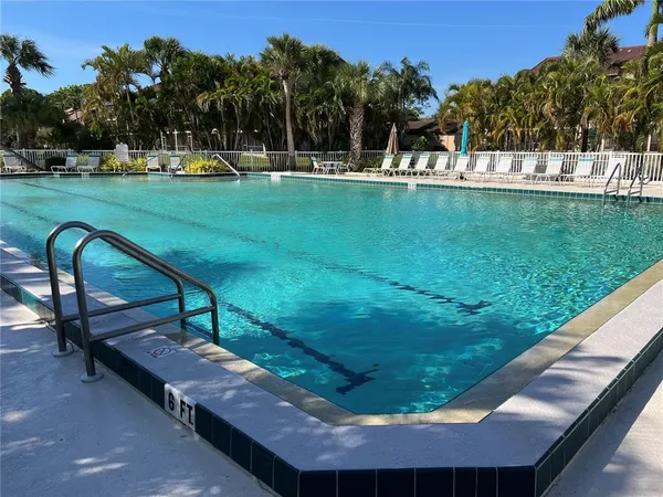 a view of a balcony with furniture and wooden floor