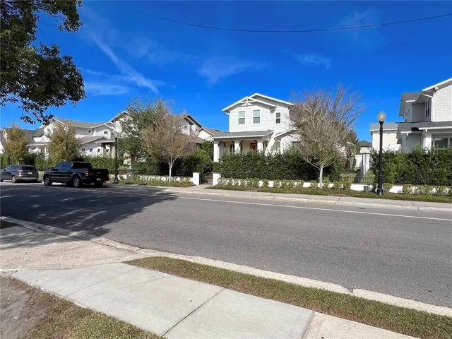 a view of street along with residential houses