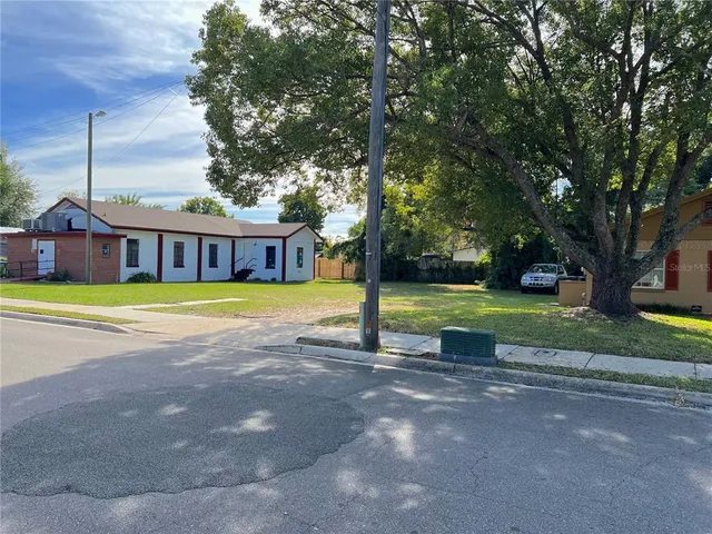 a view of a house with a big yard
