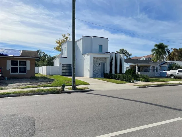 a view of a house with a street