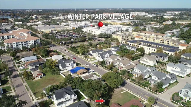 an aerial view of residential houses with city view