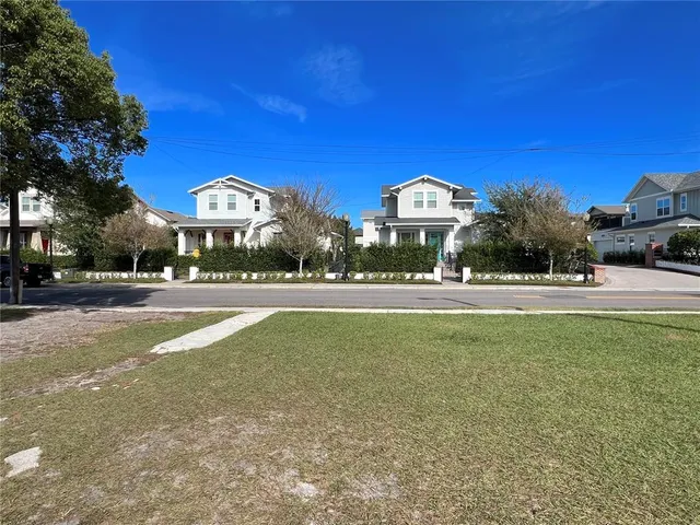 a view of the house with a yard
