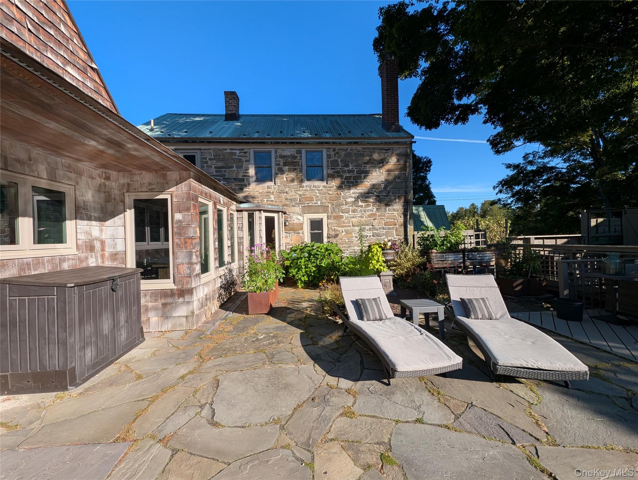 441 Scotchtown Collabar Road Middletown, NY 10941 - Photo 39 of 48 a view of a patio with couches and table and chairs with wooden floor and fence