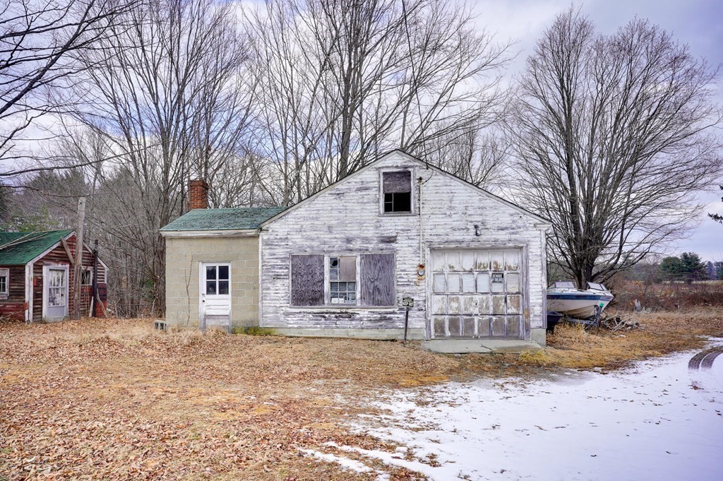 77-79 Randall Road Stow, MA 01775 - Photo 8 of 23 a white house that has a tree in front of it