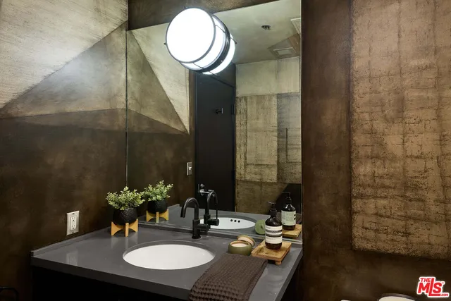 a kitchen with a stove and a wooden floors