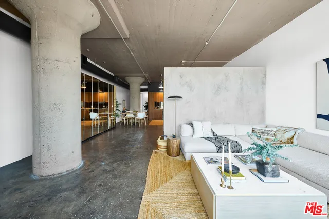 a bedroom with a bed and a mirror