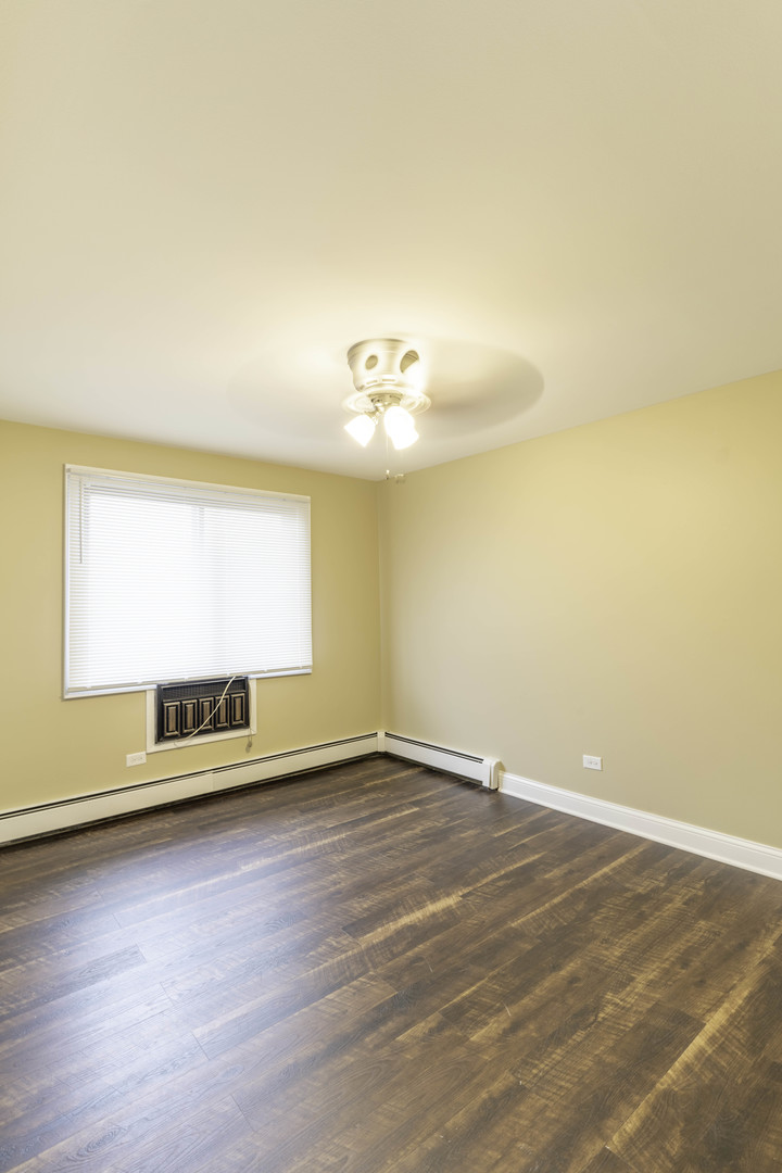 5700 South Archer Avenue, Unit 3A Chicago, IL 60638 - Photo 9 of 11 a view of an empty room with a window