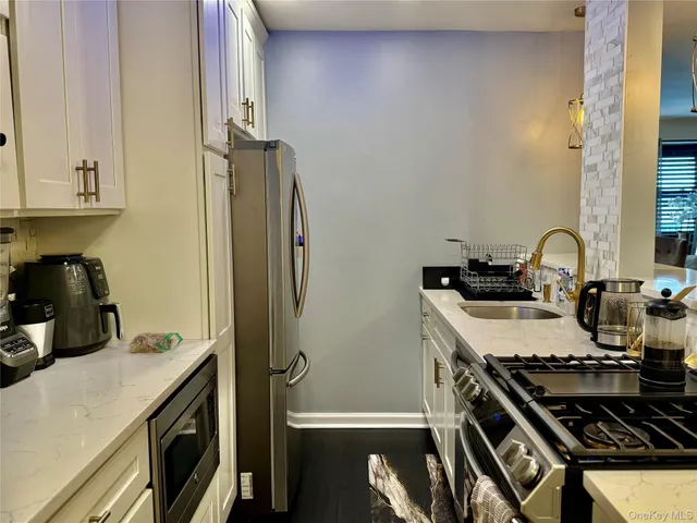 a kitchen with a stove and a refrigerator