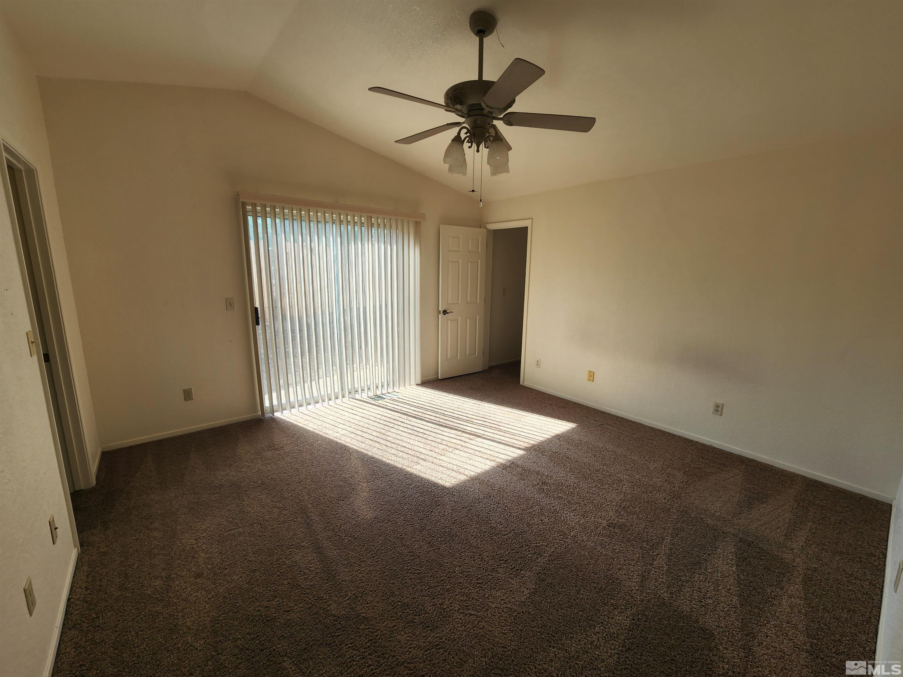 608 Boulder Circle Dayton, NV 89403 - Photo 11 of 22 an empty room with a ceiling fan and window