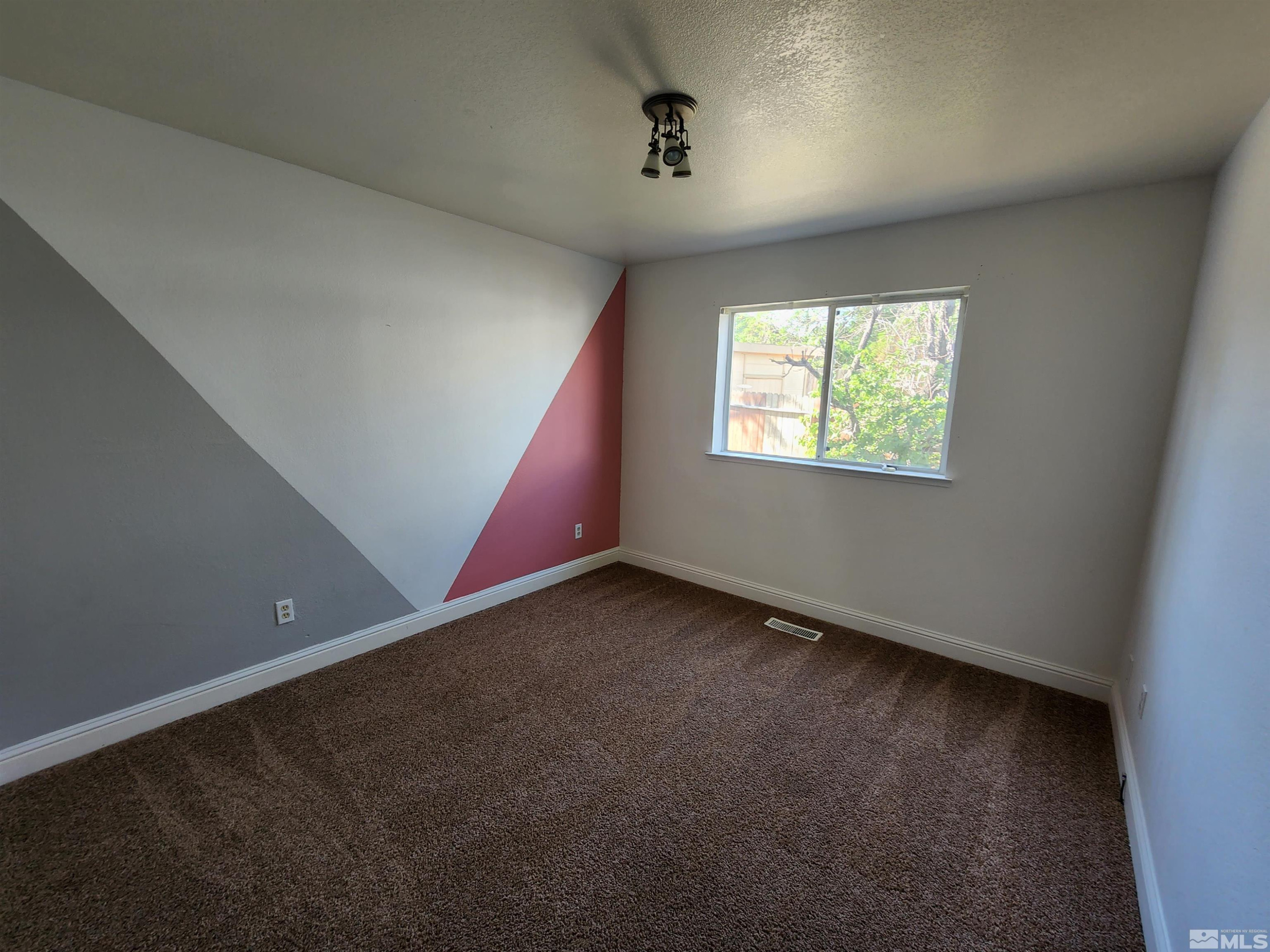 608 Boulder Circle Dayton, NV 89403 - Photo 14 of 22 an empty room with windows