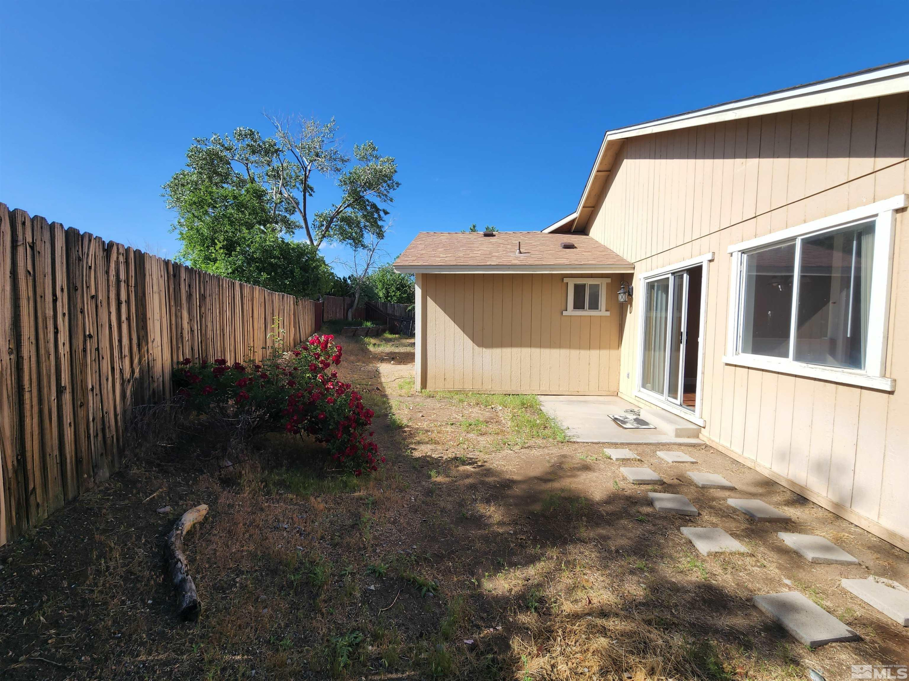 608 Boulder Circle Dayton, NV 89403 - Photo 21 of 22 a view of a house with backyard and garden