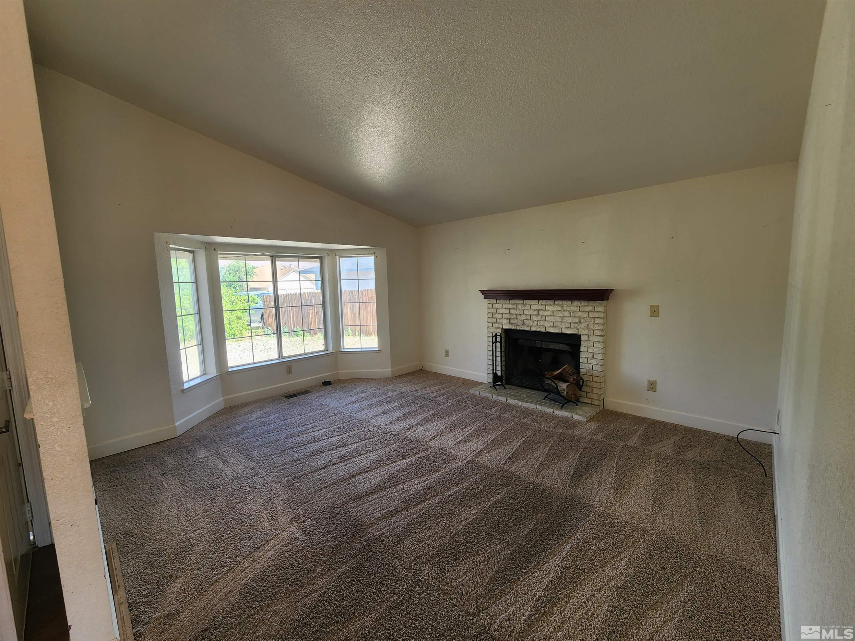 608 Boulder Circle Dayton, NV 89403 - Photo 4 of 22 a view of empty room with a fireplace