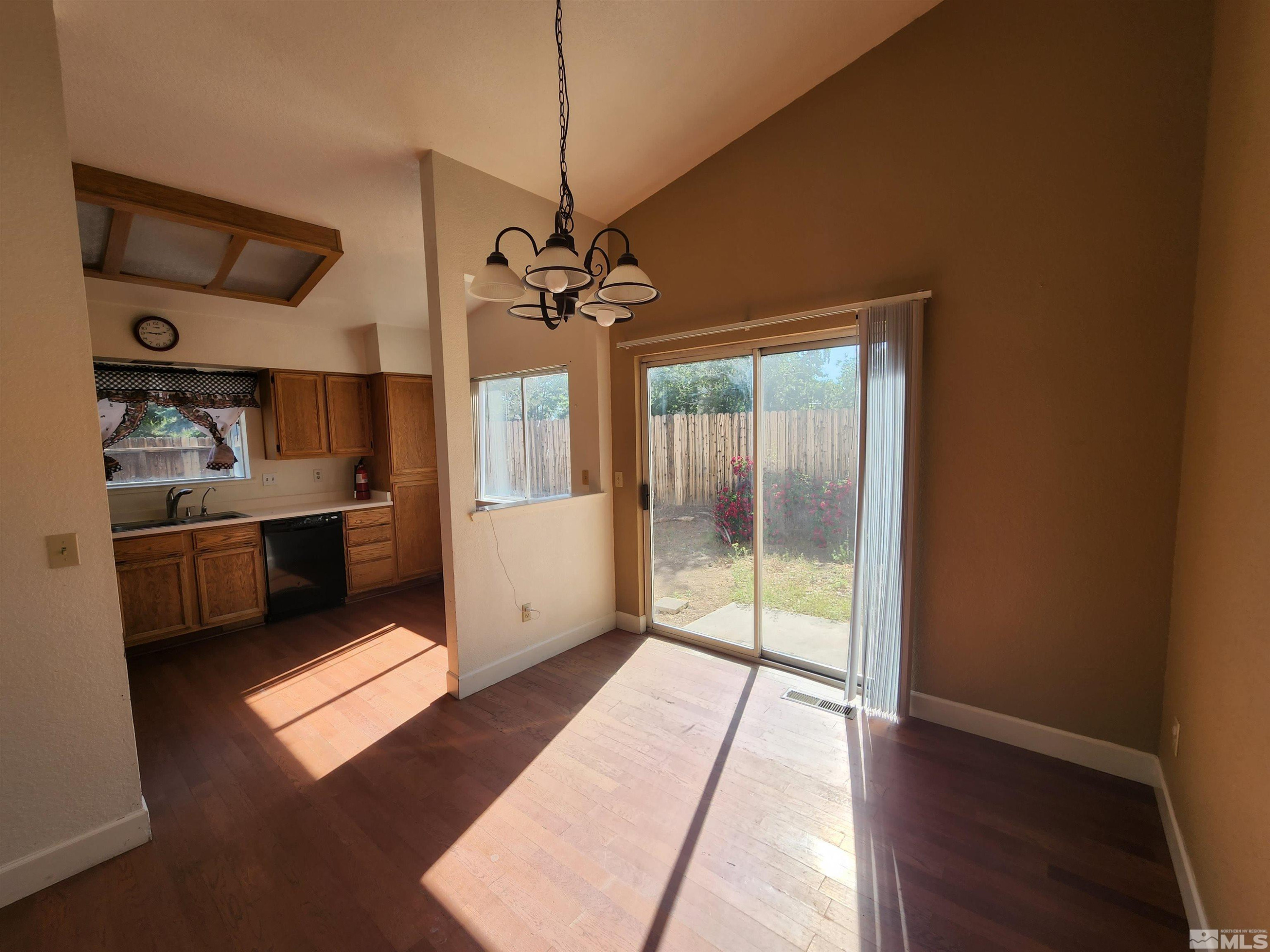 608 Boulder Circle Dayton, NV 89403 - Photo 5 of 22 a view of a kitchen with a sink and dishwasher cabinet with wooden floor