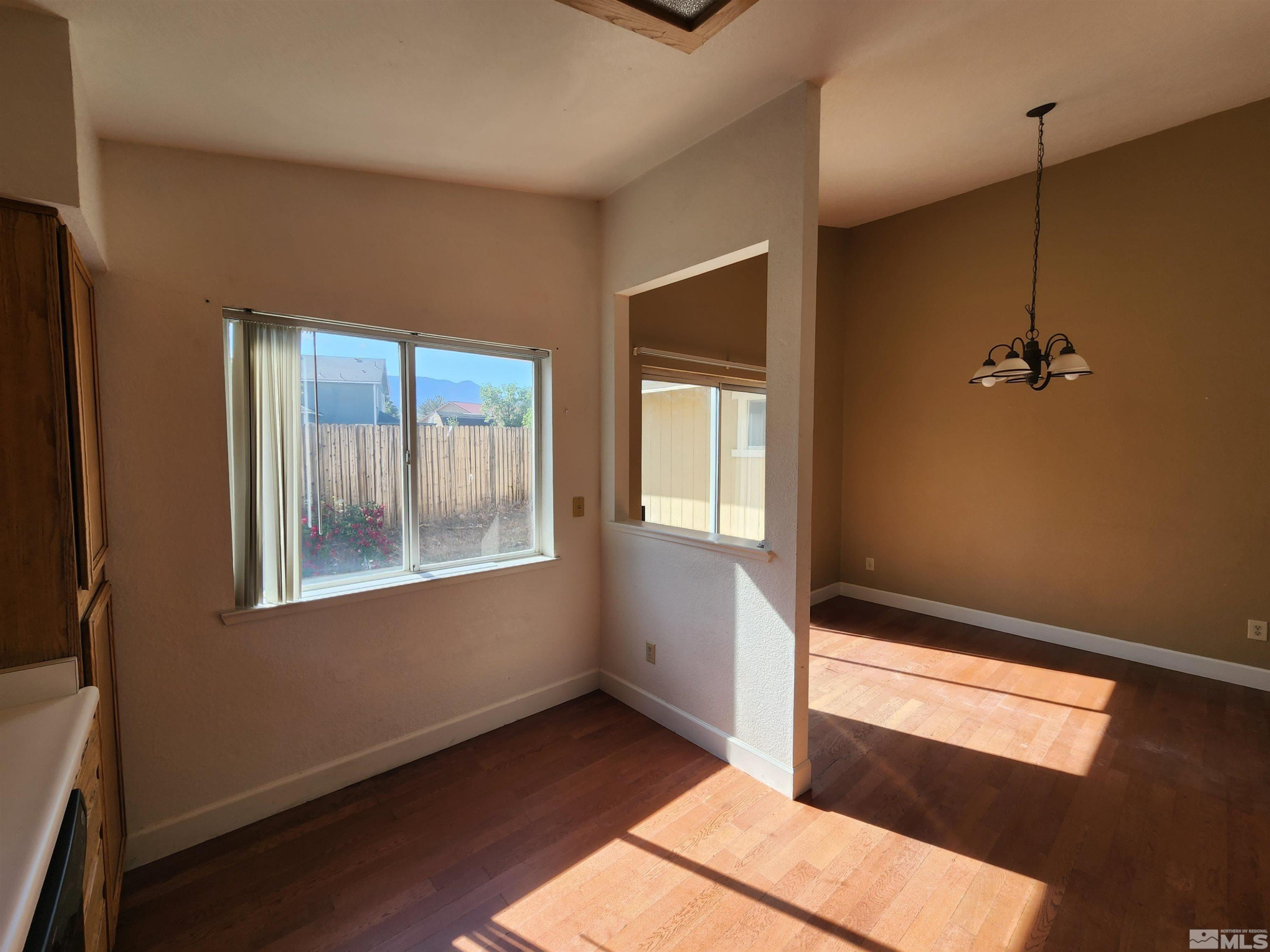 608 Boulder Circle Dayton, NV 89403 - Photo 6 of 22 an empty room with windows