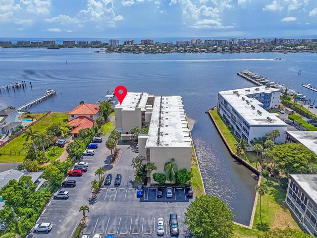 an aerial view of a house with a lake view