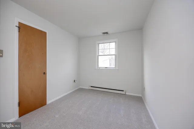 a view of a hallway with closet