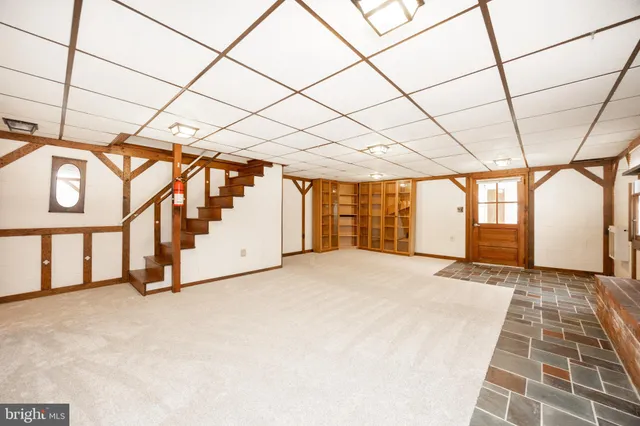 a view of an empty room with a fireplace