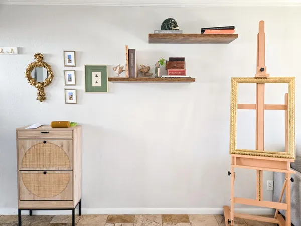 a view of storage and utility room with a window
