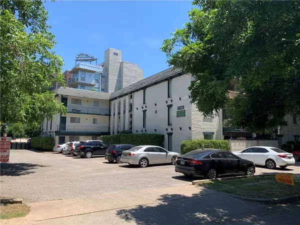 a car parked in front of a building