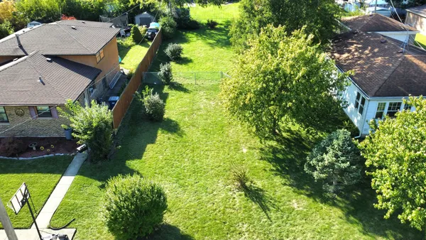 an aerial view of house with yard