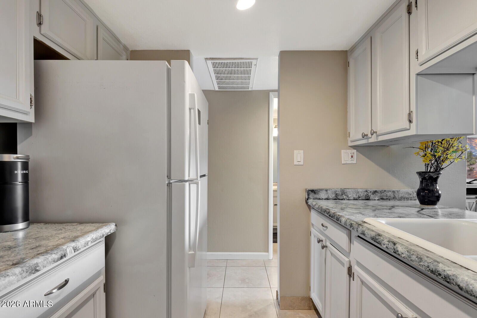 7436 East Chaparral Road, Unit B228 Scottsdale, AZ 85250 - Photo 12 of 17 a kitchen with stainless steel appliances granite countertop a refrigerator and a sink