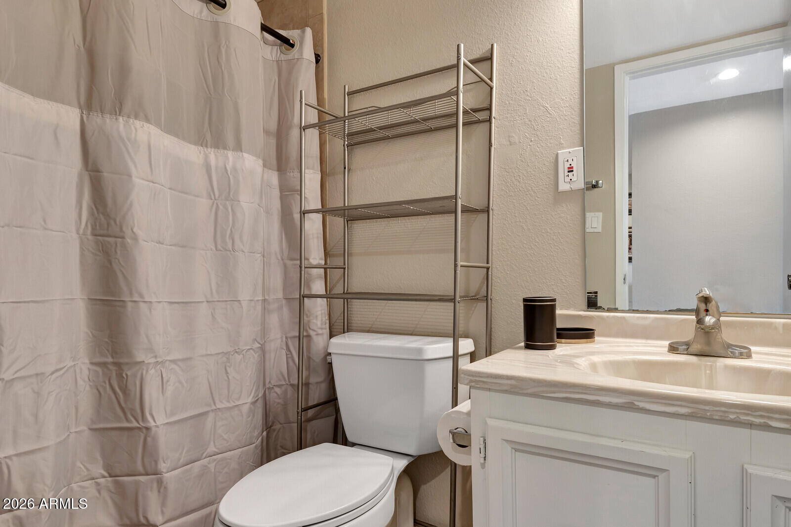 7436 East Chaparral Road, Unit B228 Scottsdale, AZ 85250 - Photo 13 of 17 a bathroom with a granite countertop toilet sink and shower