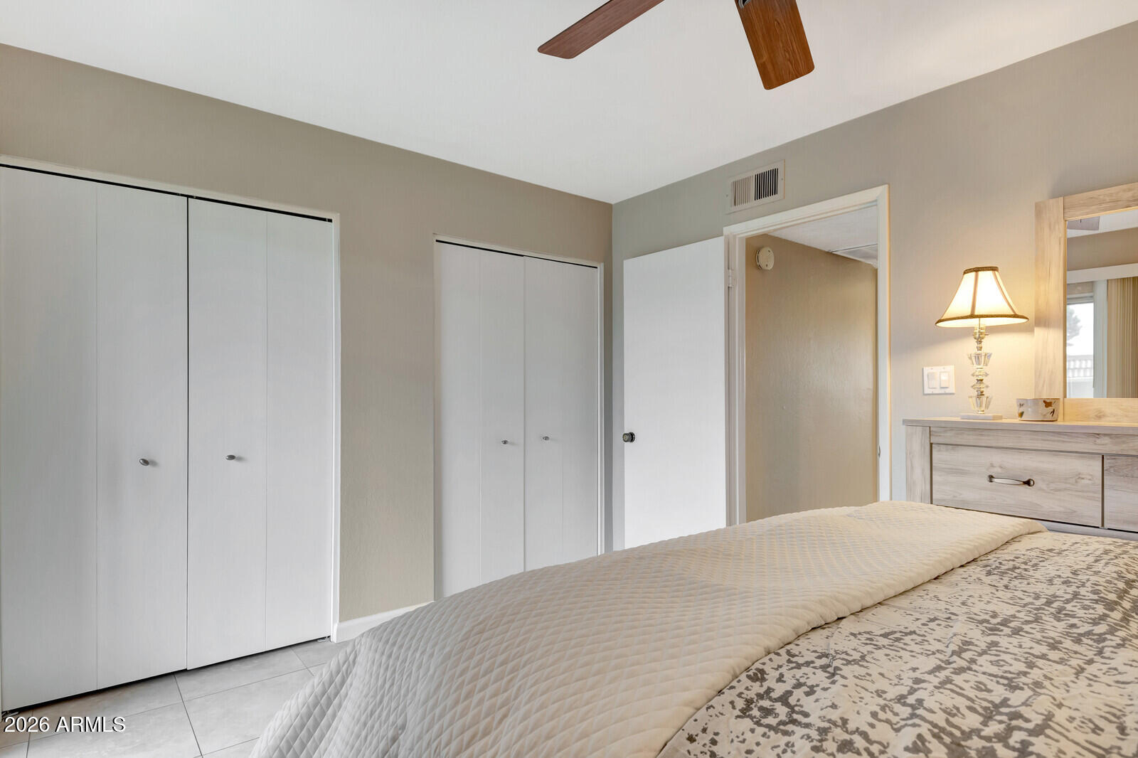 7436 East Chaparral Road, Unit B228 Scottsdale, AZ 85250 - Photo 16 of 17 a bedroom with a bed and cabinets