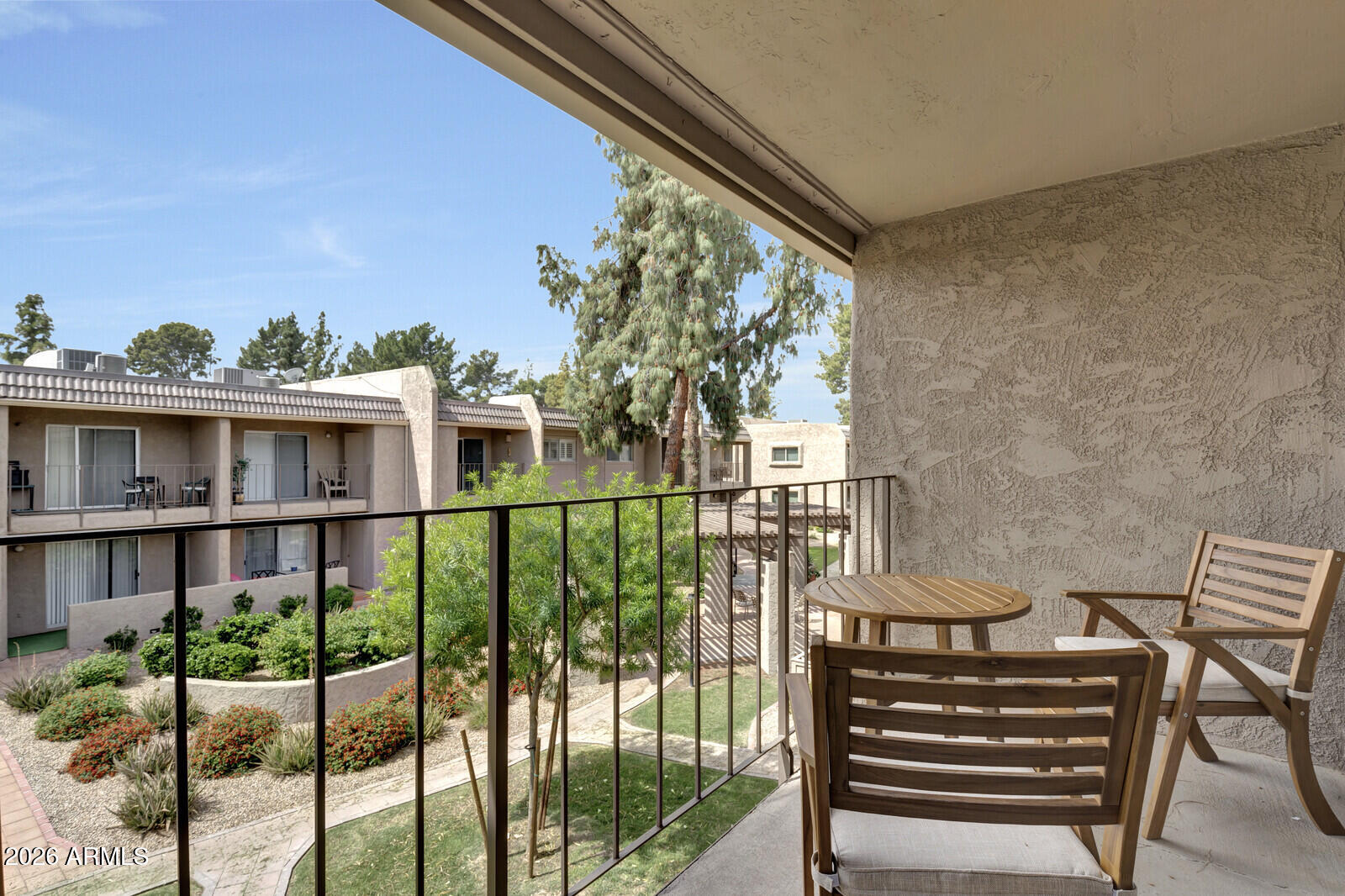 7436 East Chaparral Road, Unit B228 Scottsdale, AZ 85250 - Photo 17 of 17 a view of a balcony with chairs