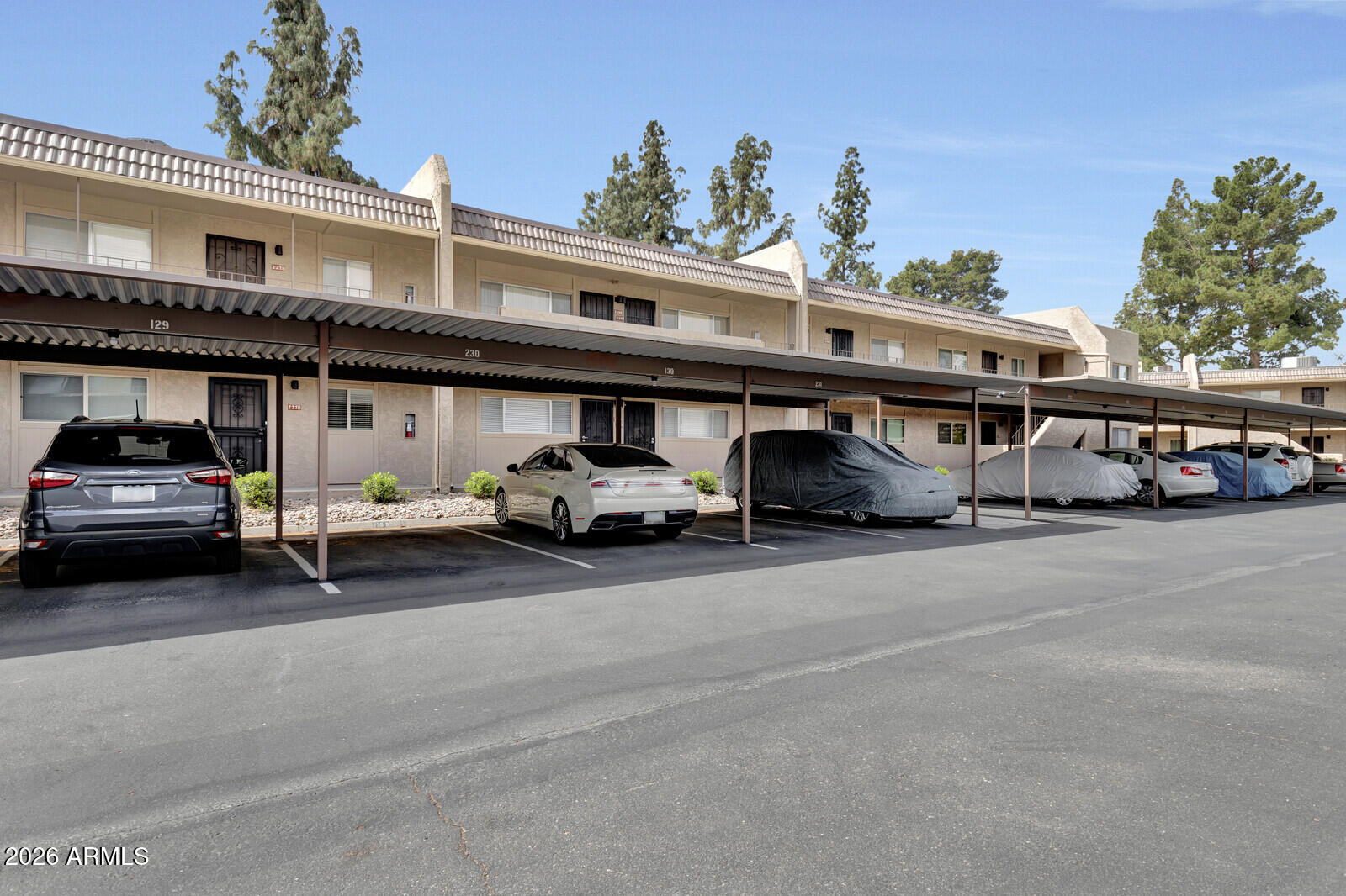 7436 East Chaparral Road, Unit B228 Scottsdale, AZ 85250 - Photo 2 of 17 a car parked in front of a building