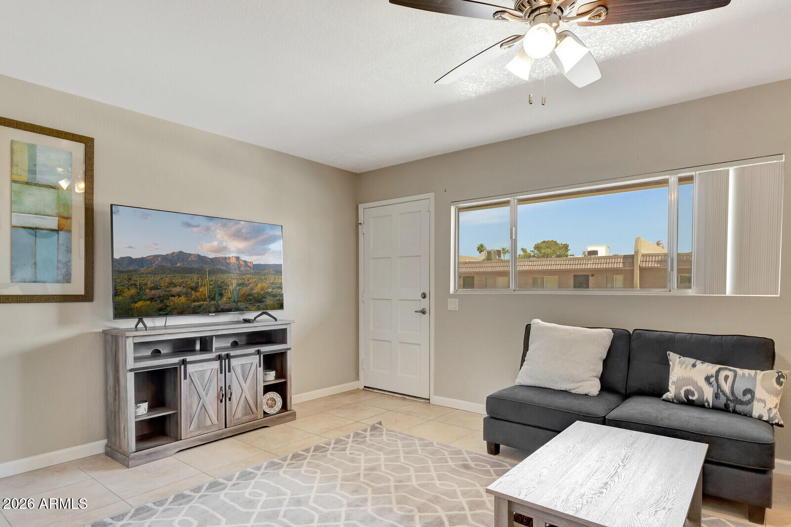 7436 East Chaparral Road, Unit B228 Scottsdale, AZ 85250 - Photo 5 of 17 a living room with furniture and a flat screen tv