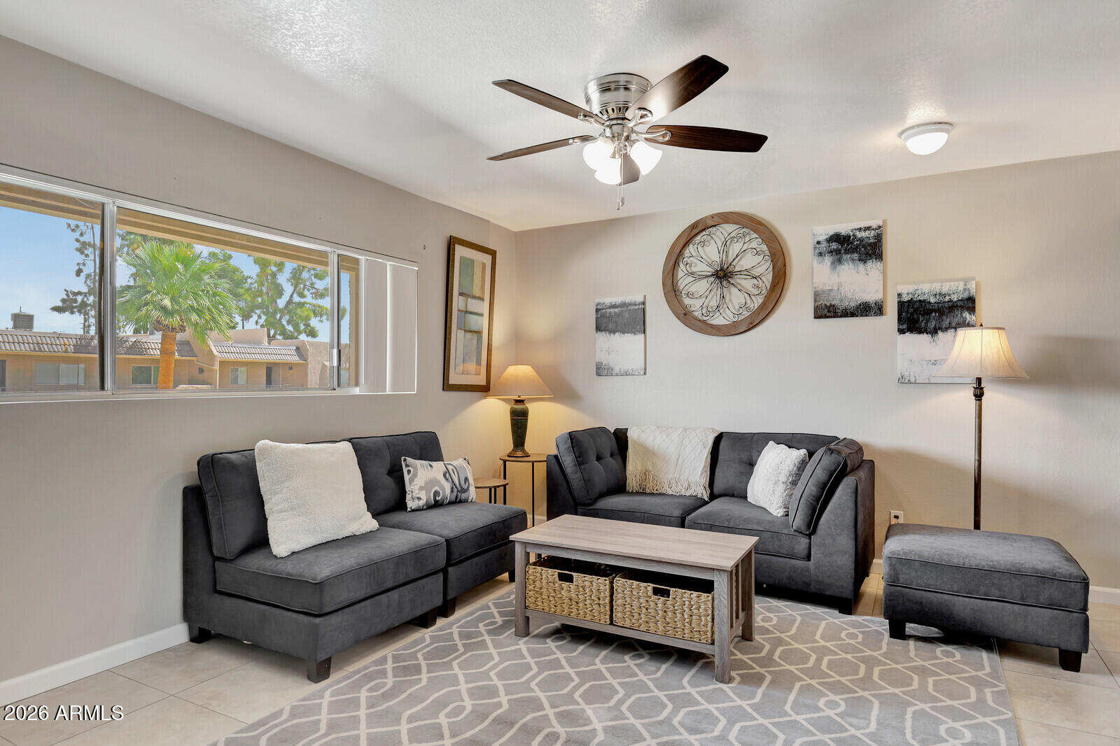 7436 East Chaparral Road, Unit B228 Scottsdale, AZ 85250 - Photo 6 of 17 a living room with furniture a clock and a large window