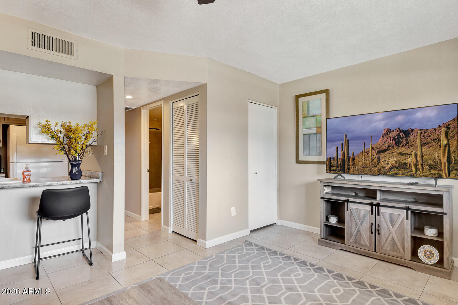 7436 East Chaparral Road, Unit B228 Scottsdale, AZ 85250 - Photo 7 of 17 a view of living room and kitchen with furniture