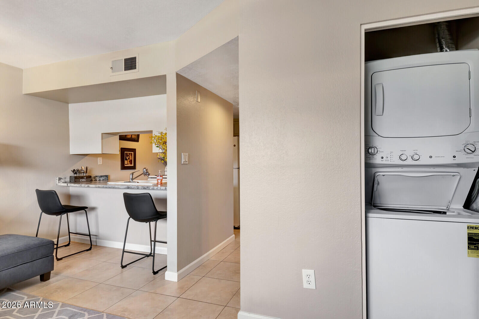 7436 East Chaparral Road, Unit B228 Scottsdale, AZ 85250 - Photo 8 of 17 a room with furniture a washer and dryer