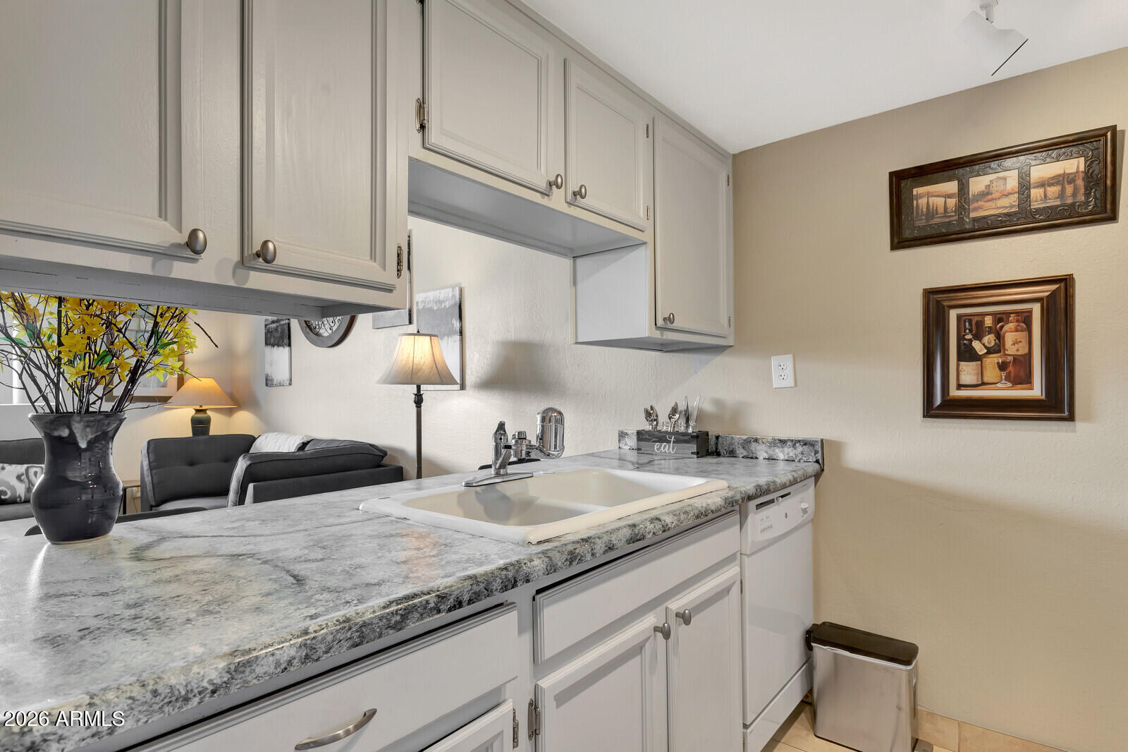 7436 East Chaparral Road, Unit B228 Scottsdale, AZ 85250 - Photo 10 of 17 a kitchen with granite countertop a sink a stove and cabinets