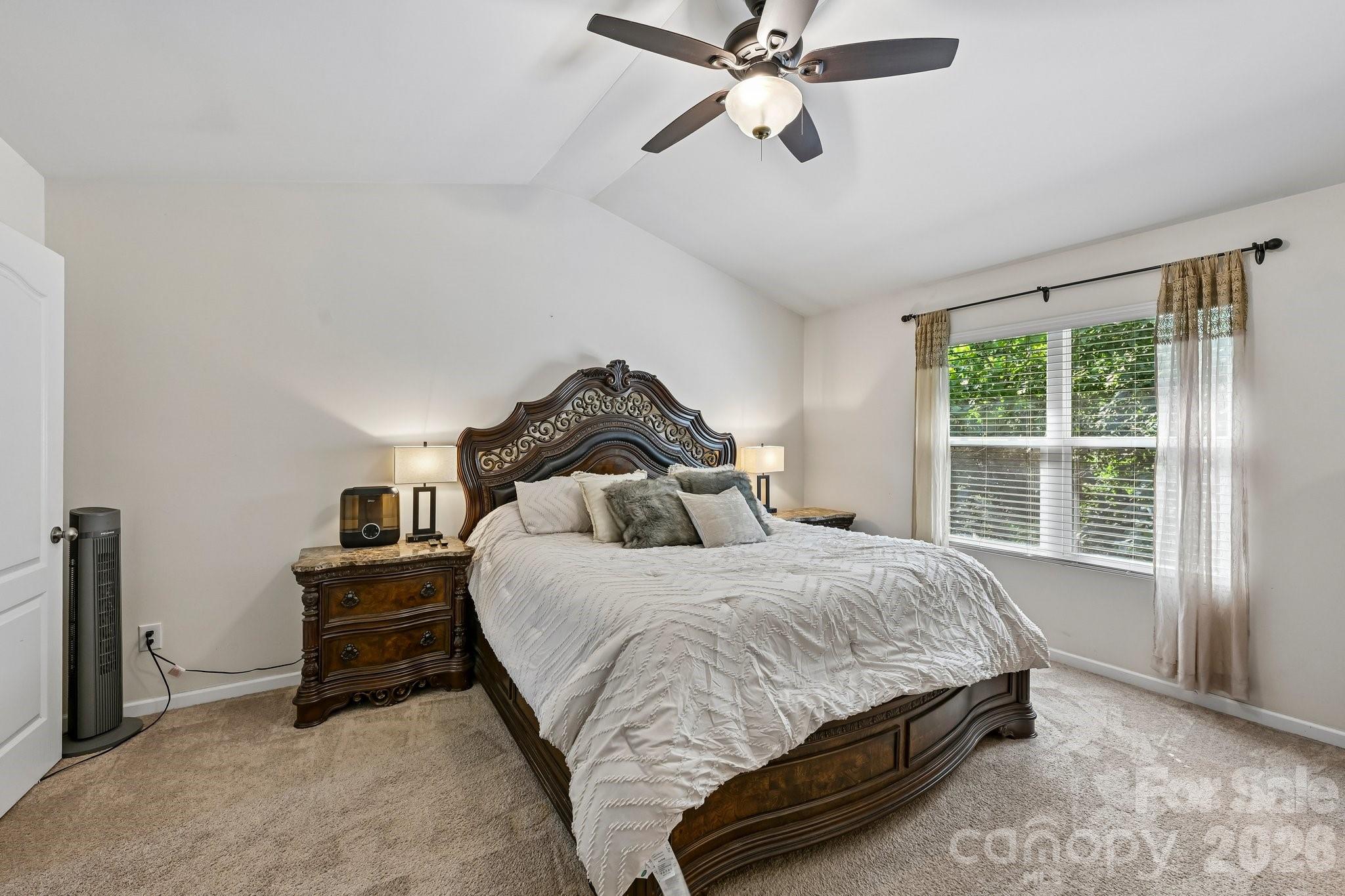2206 Turtle Point Road Charlotte, NC 28262 - Photo 15 of 28 a bedroom with a bed and window