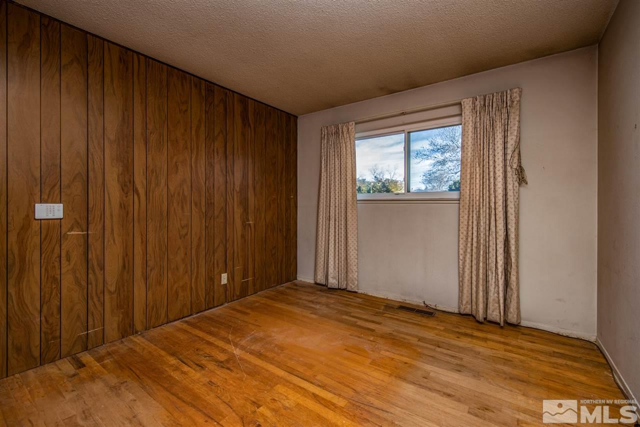 405 Gregory Way Sparks, NV 89431 - Photo 18 of 24 a view of empty room with wooden floor
