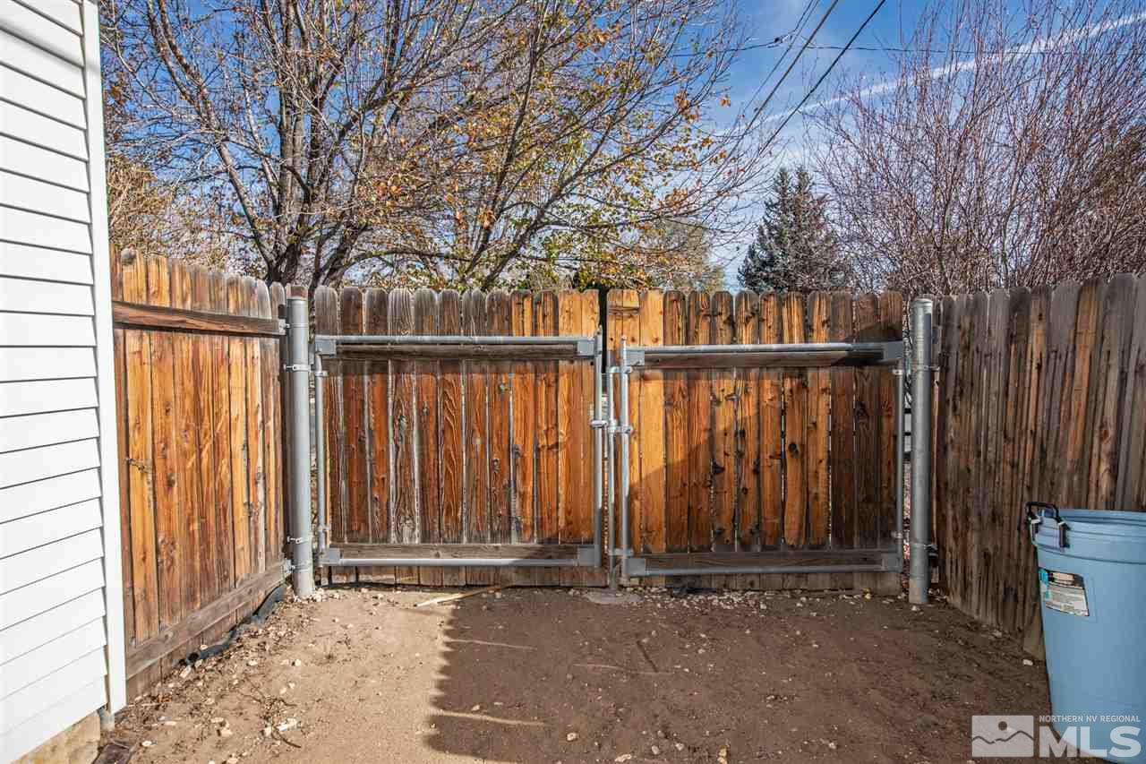 405 Gregory Way Sparks, NV 89431 - Photo 21 of 24 a view of wooden fence and trees