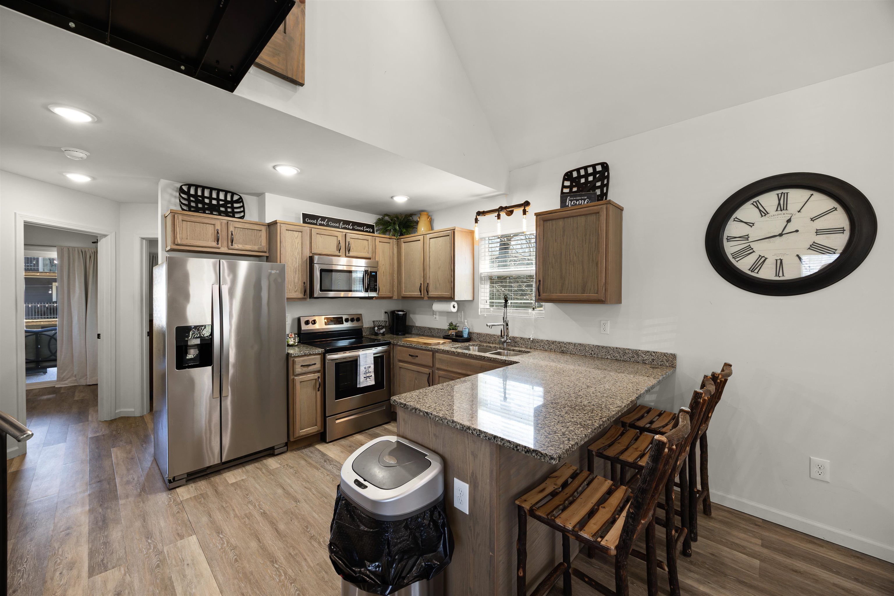15 Bogey Loop Counce, TN 38326 - Photo 6 of 17 a kitchen with granite countertop a table chairs stove and refrigerator