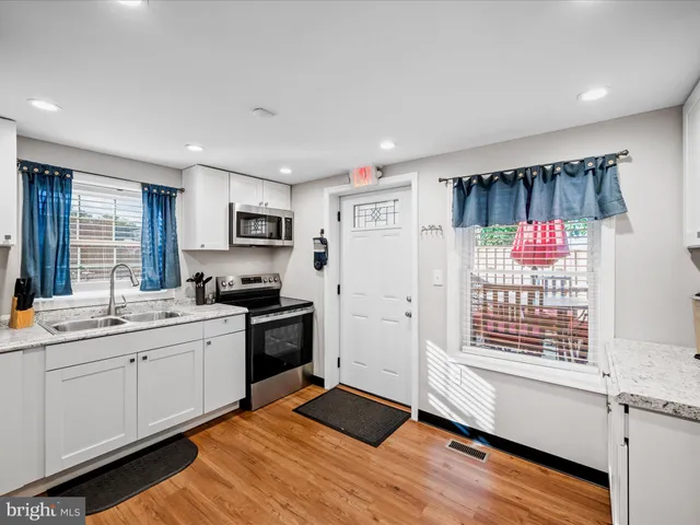 a bathroom with a toilet a sink and a mirror