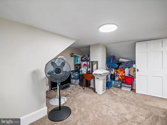 a view of a chairs and table in the balcony