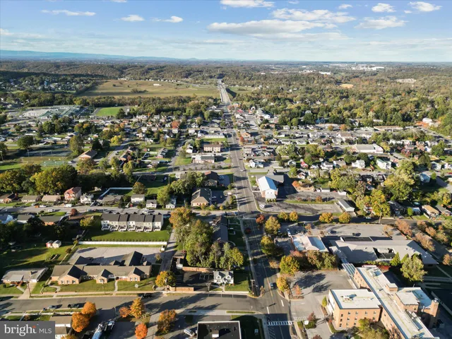 an aerial view of residential building with parking